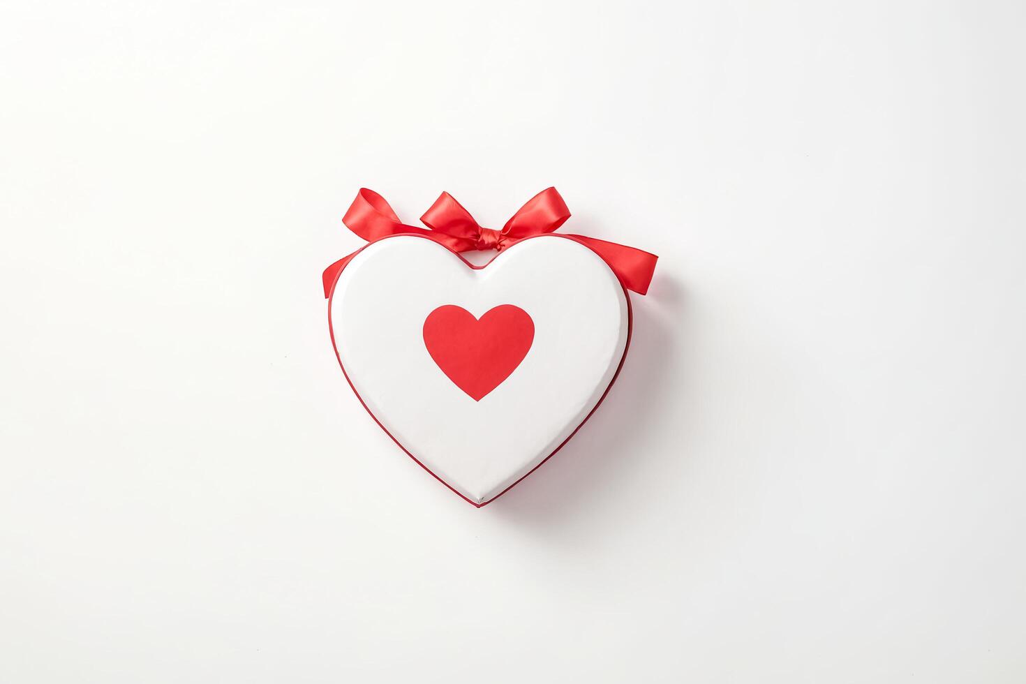Heart Shaped Gift Box with Red Bow photo