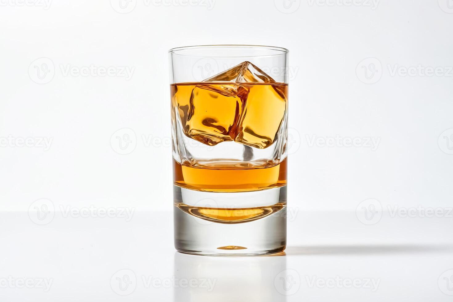 Glass of whiskey with ice cubes on a white background photo
