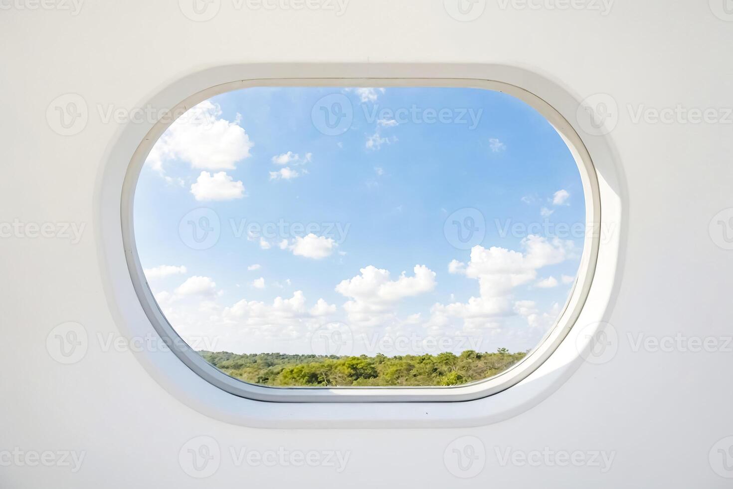 Round Window with a View of the Sky and Forest photo