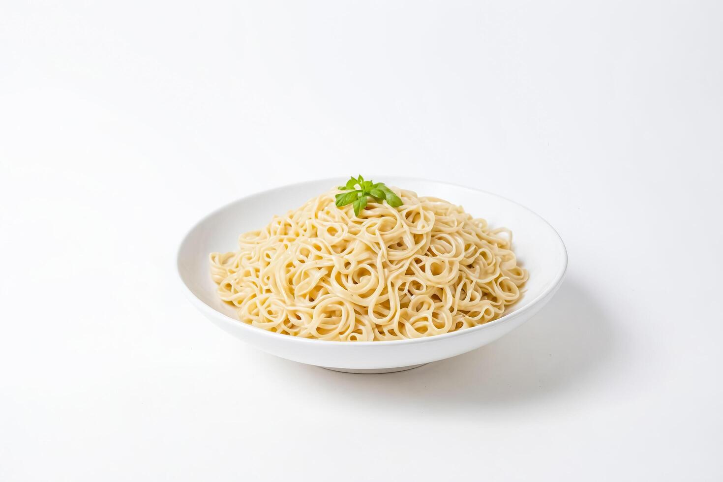 Close-Up of a Bowl of Plain Spaghetti with Basil photo