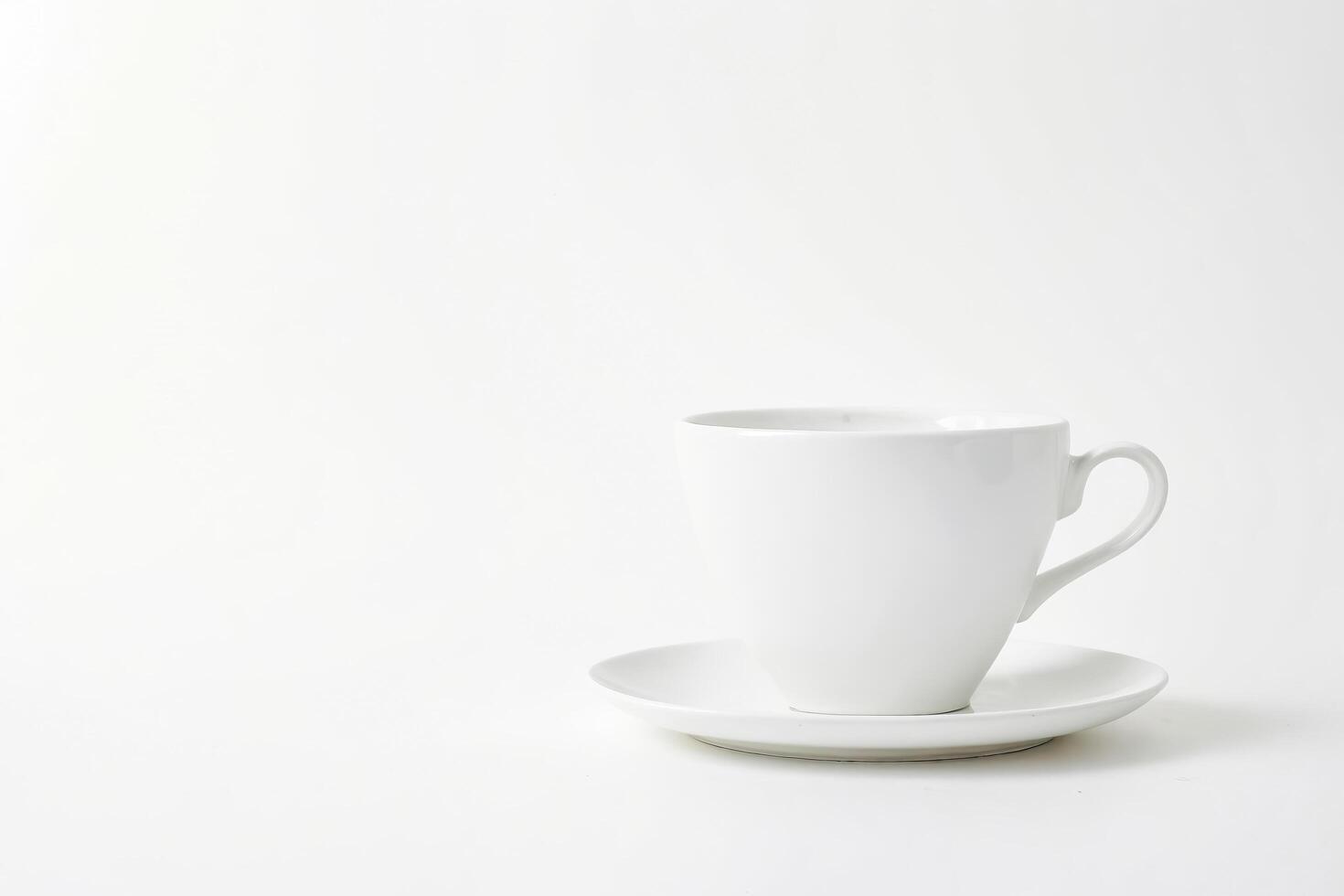 White Coffee Cup and Saucer on White Background photo