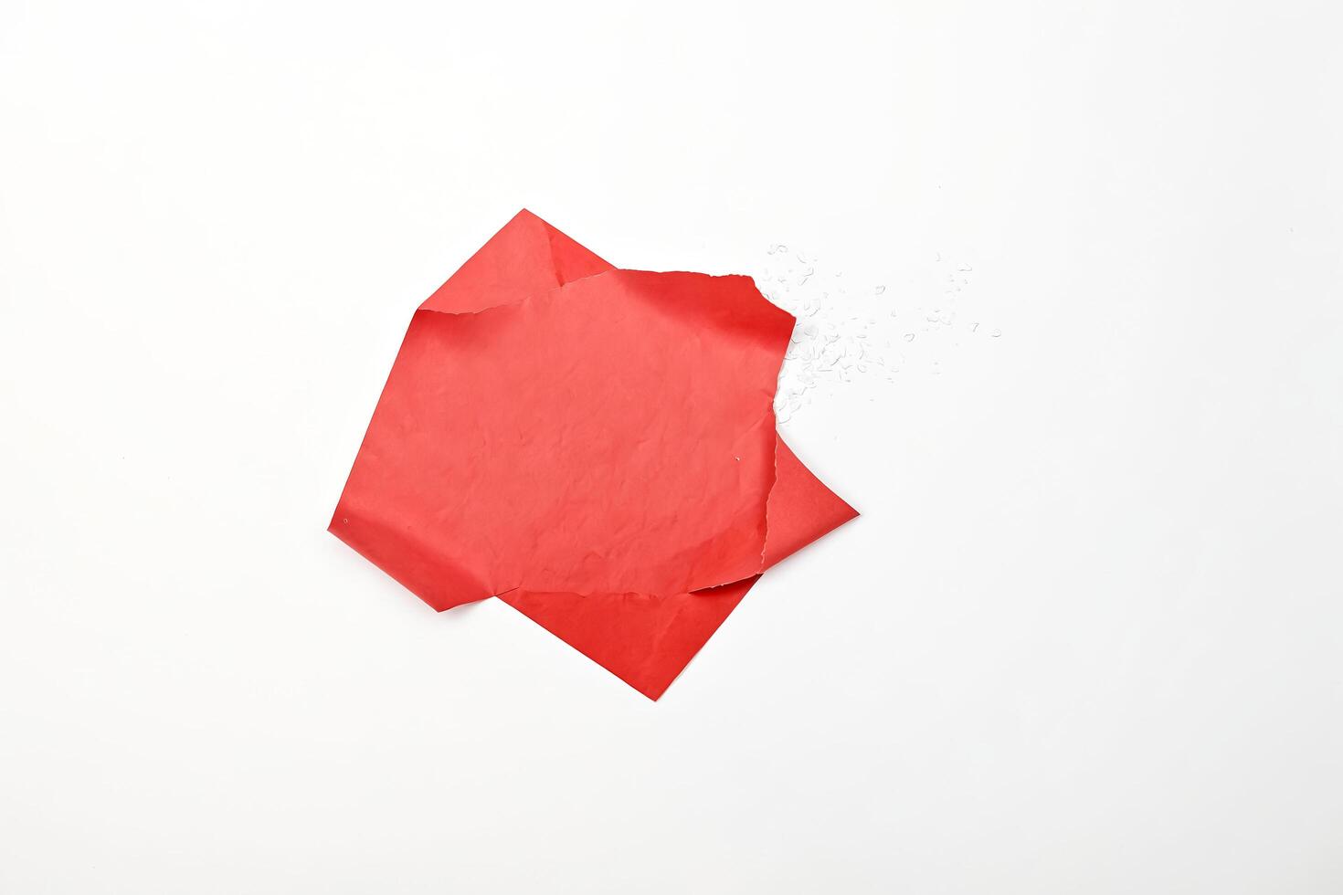 Red Envelope with Confetti on White Background photo