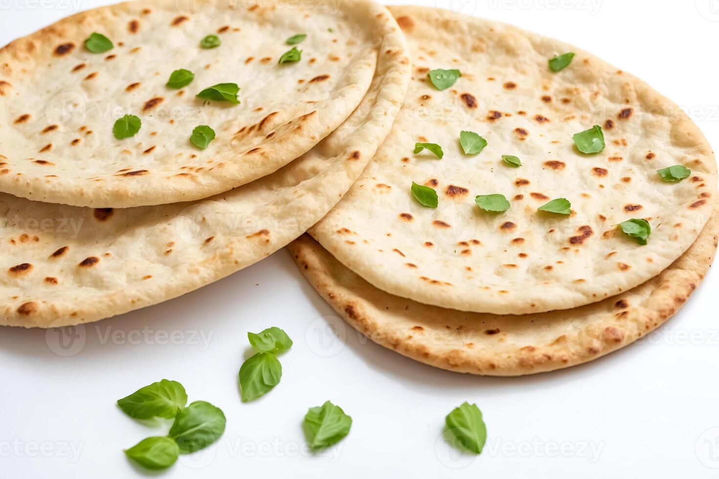 Close-up of Freshly Baked Naan Bread with Basil Leaves photo