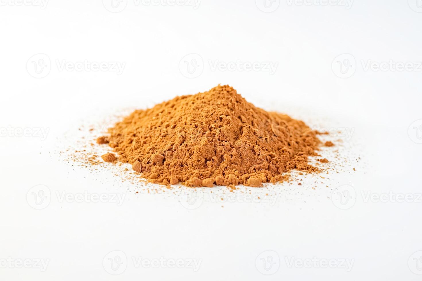 Close-up of Cinnamon Powder on White Background photo