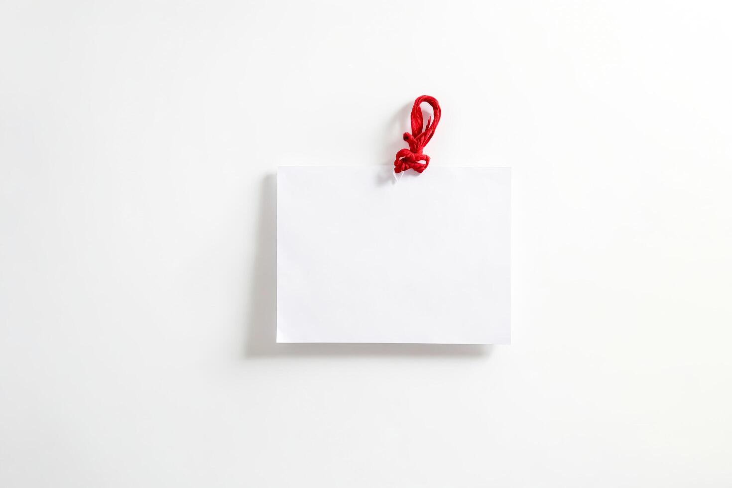 Blank White Paper With Red String photo