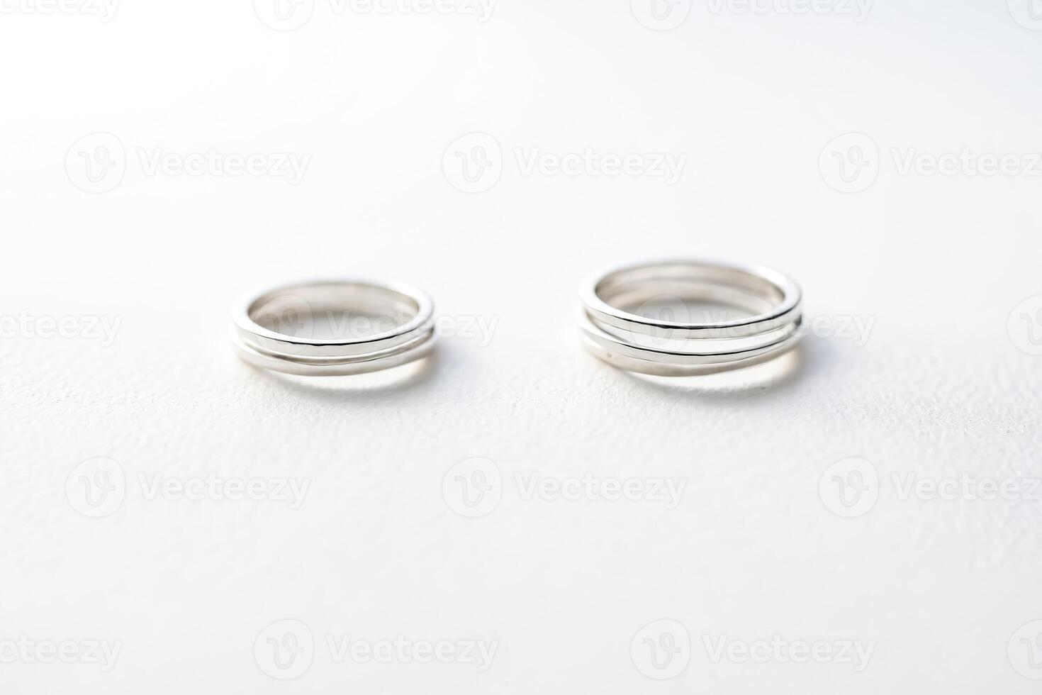 Two silver rings on a white background photo