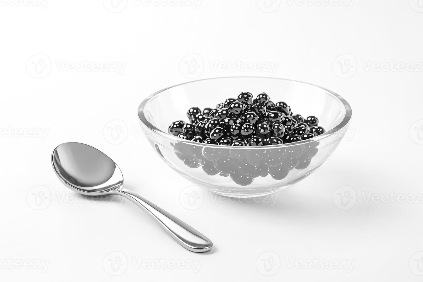 Black Caviar in a Glass Bowl with a Silver Spoon photo