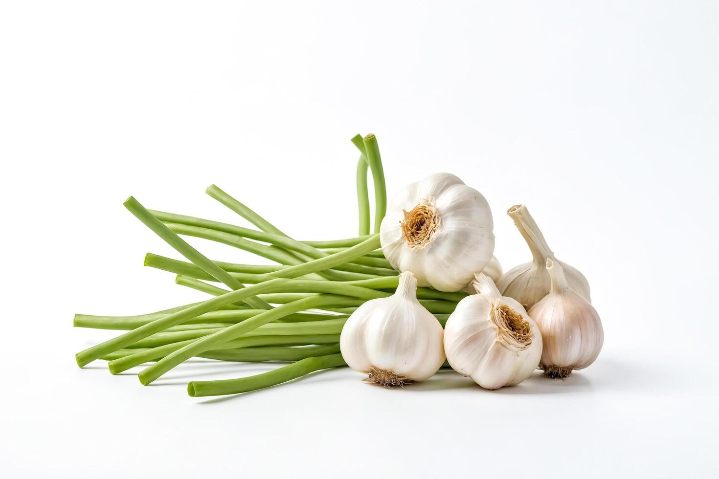 Fresh Garlic Cloves with Green Stalks on White Background photo