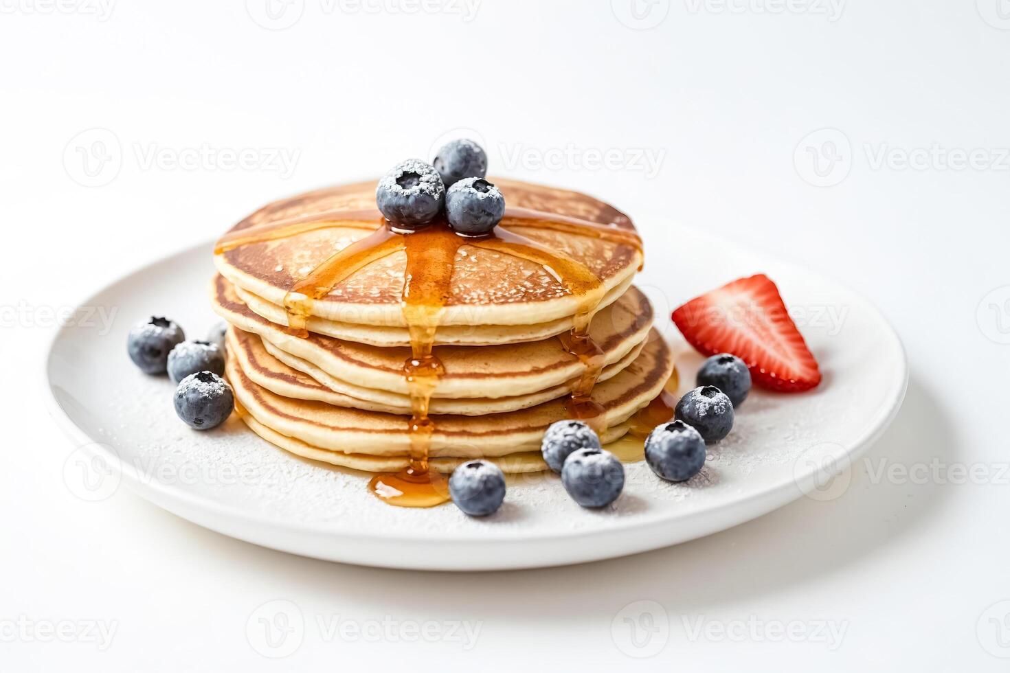 Stack of Pancakes with Syrup and Berries photo