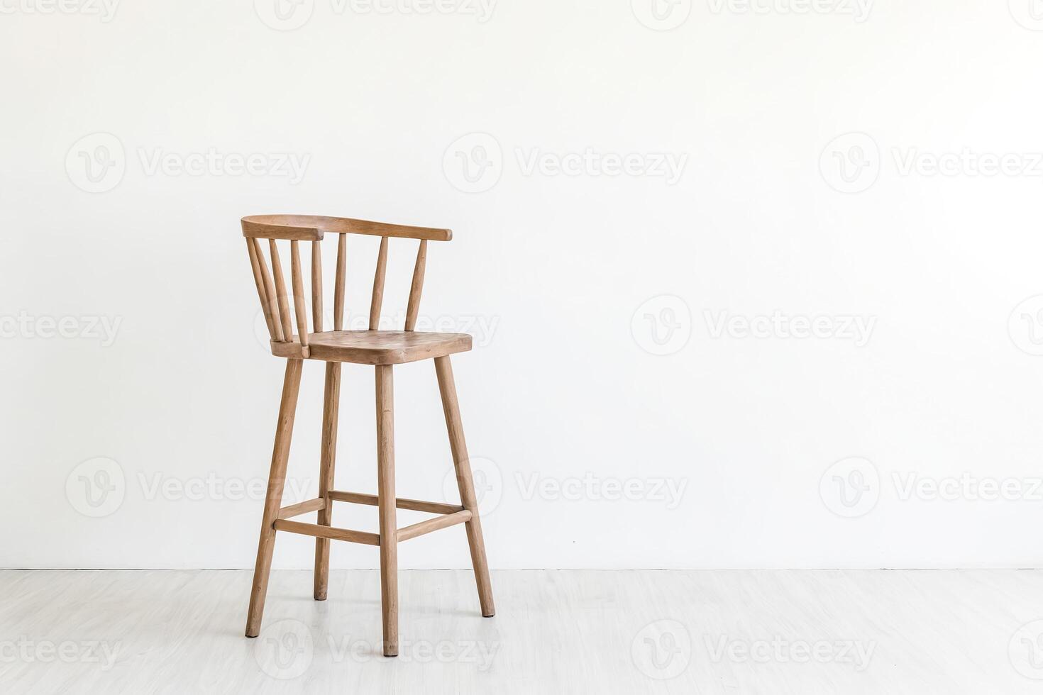 Wooden Bar Stool in Front of White Wall photo