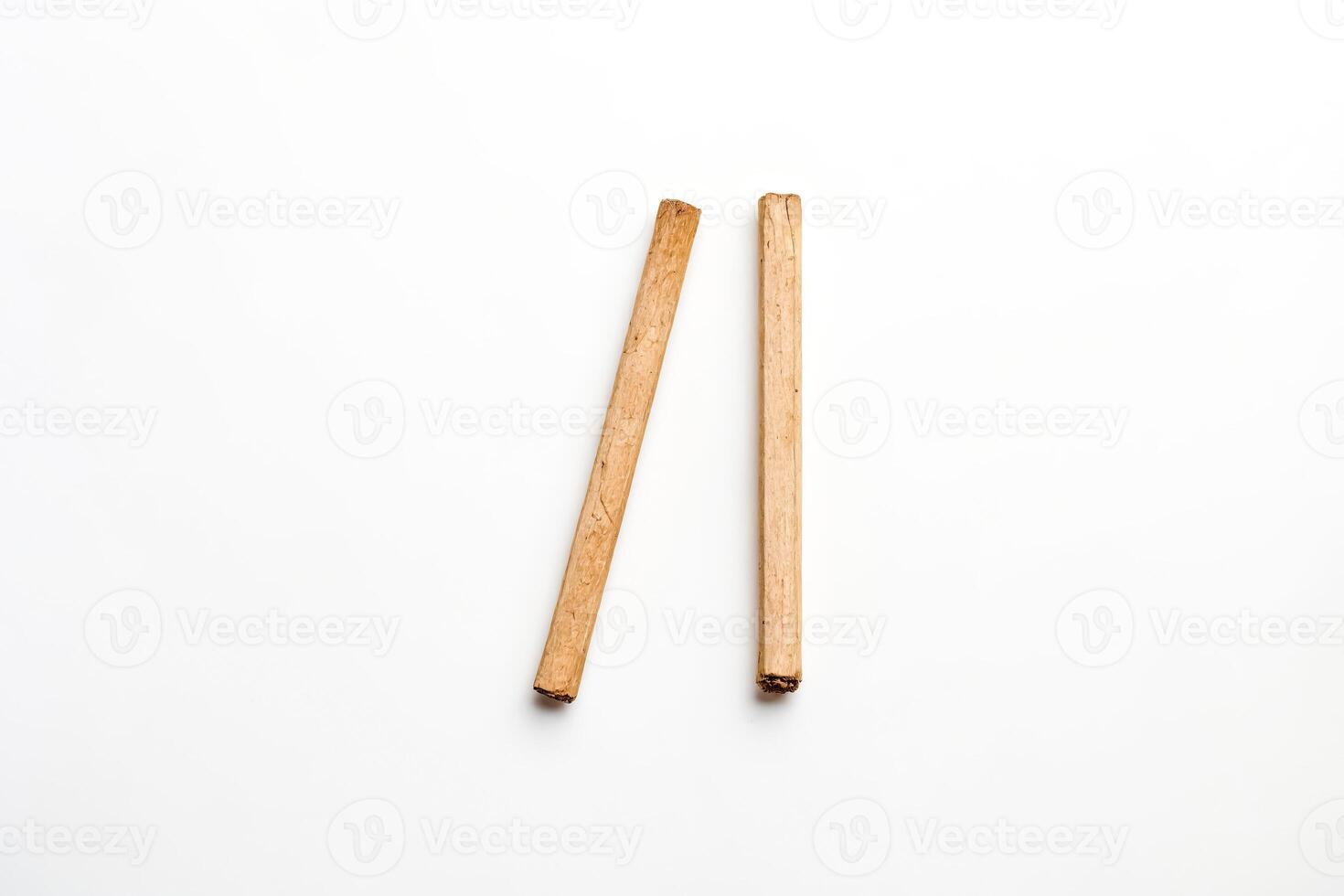 Two Cinnamon Sticks on White Background photo