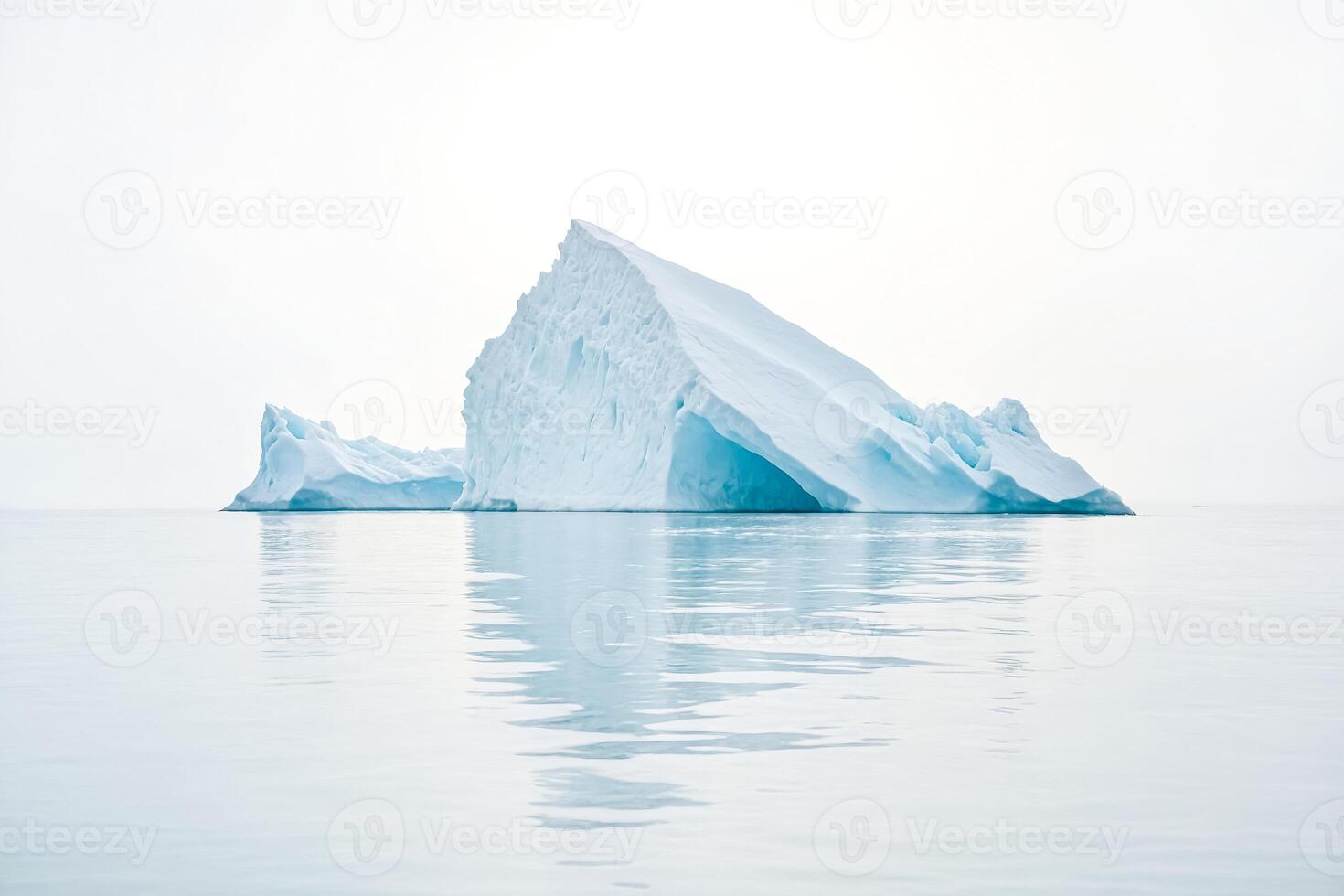 Majestic Iceberg Floating in Calm Waters photo