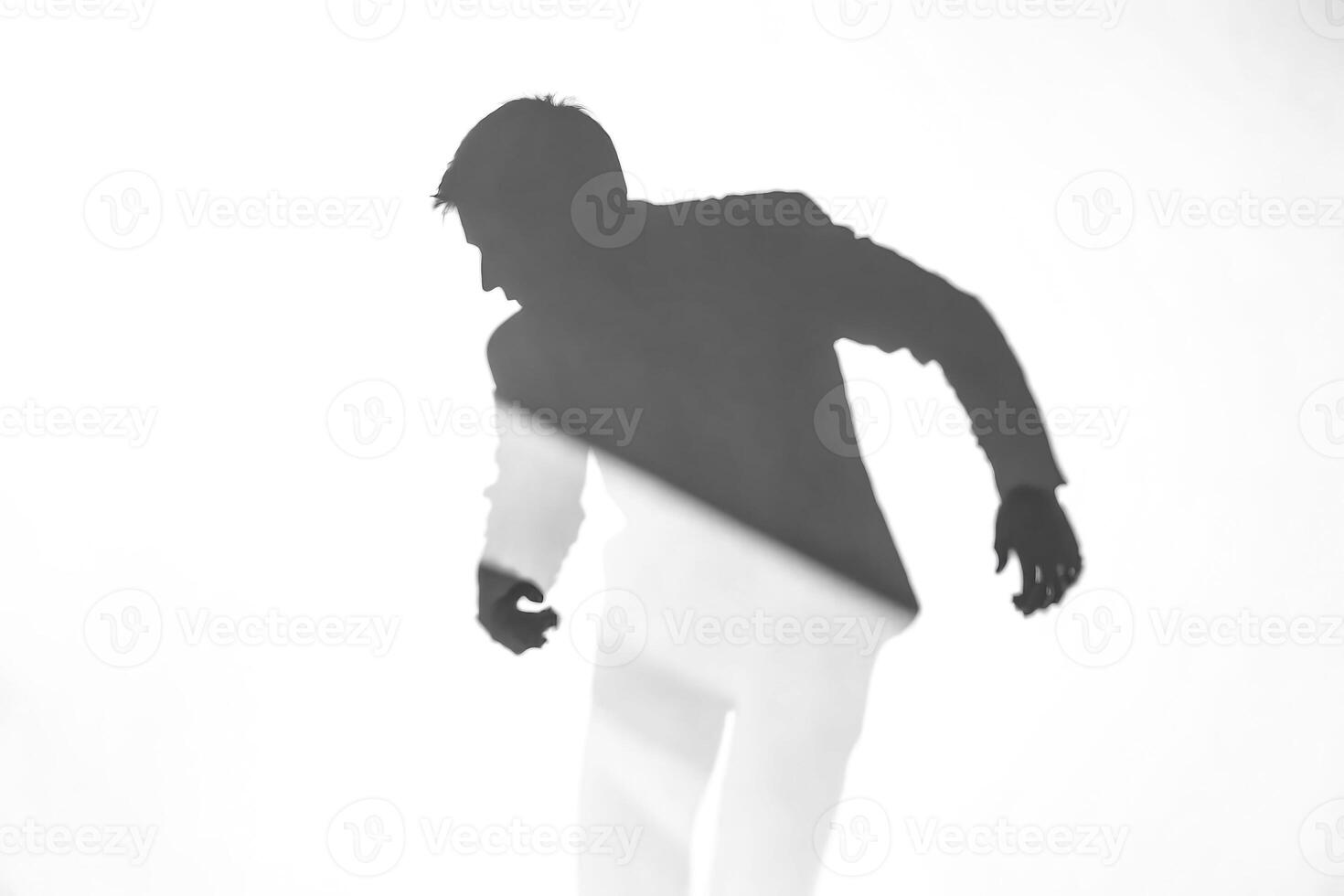 Shadow of a Man on a White Wall photo