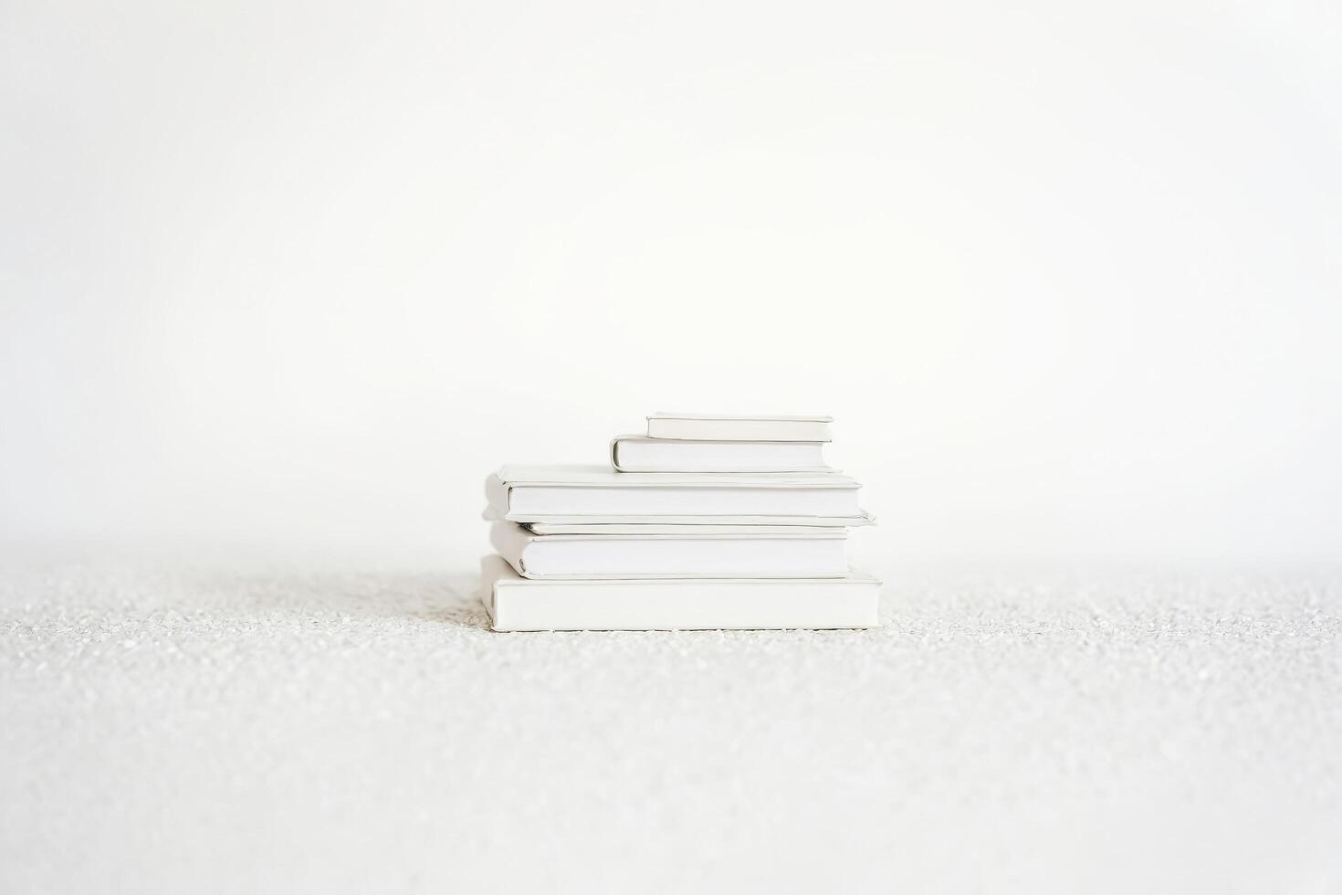 Stack of White Books on a White Surface photo
