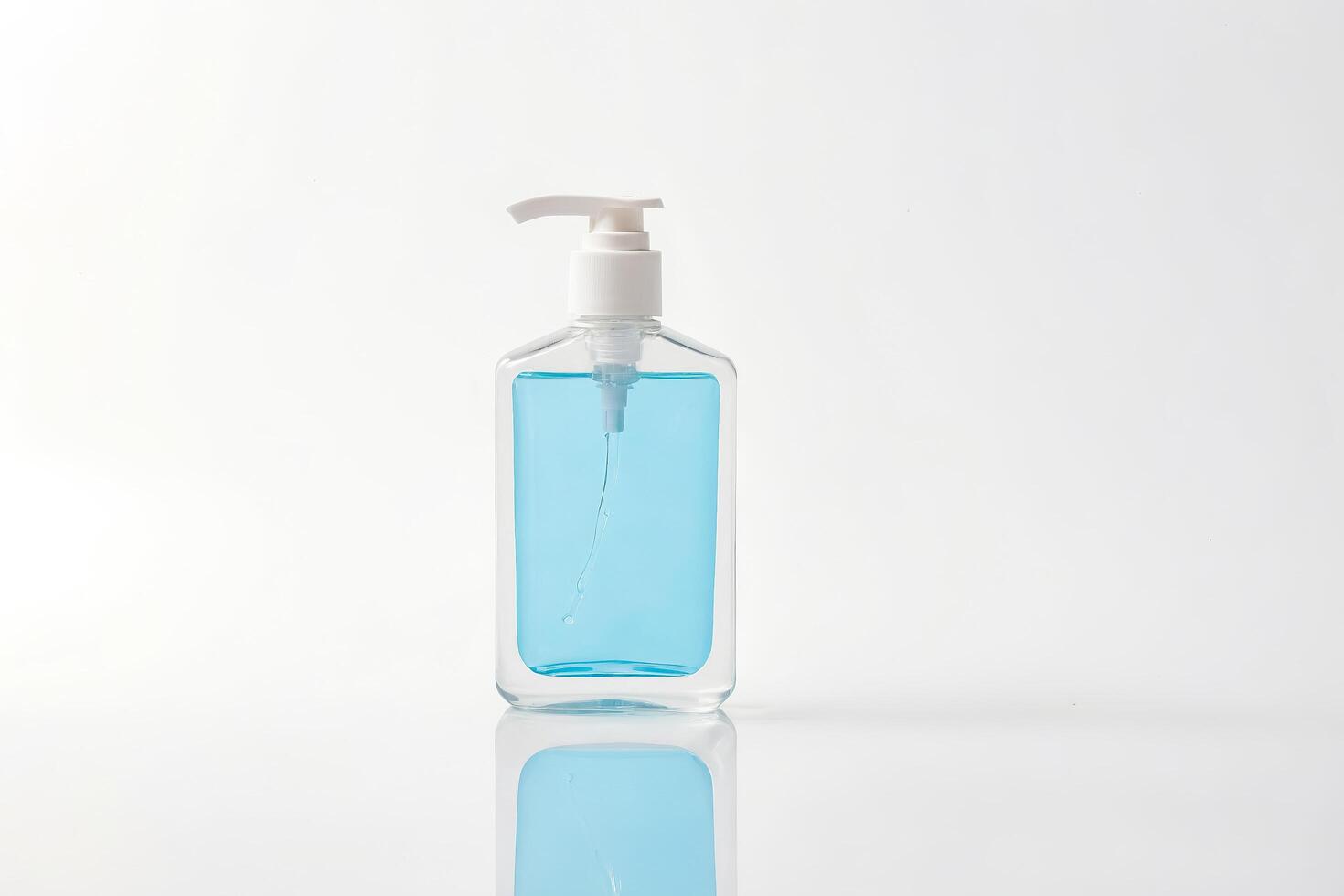 Clear Hand Sanitizer Bottle with Pump on White Background photo