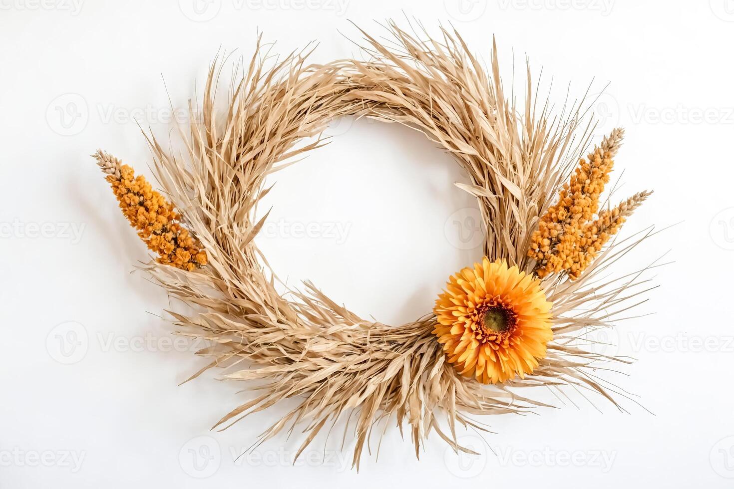 Dried Grass and Flower Wreath on White Background photo
