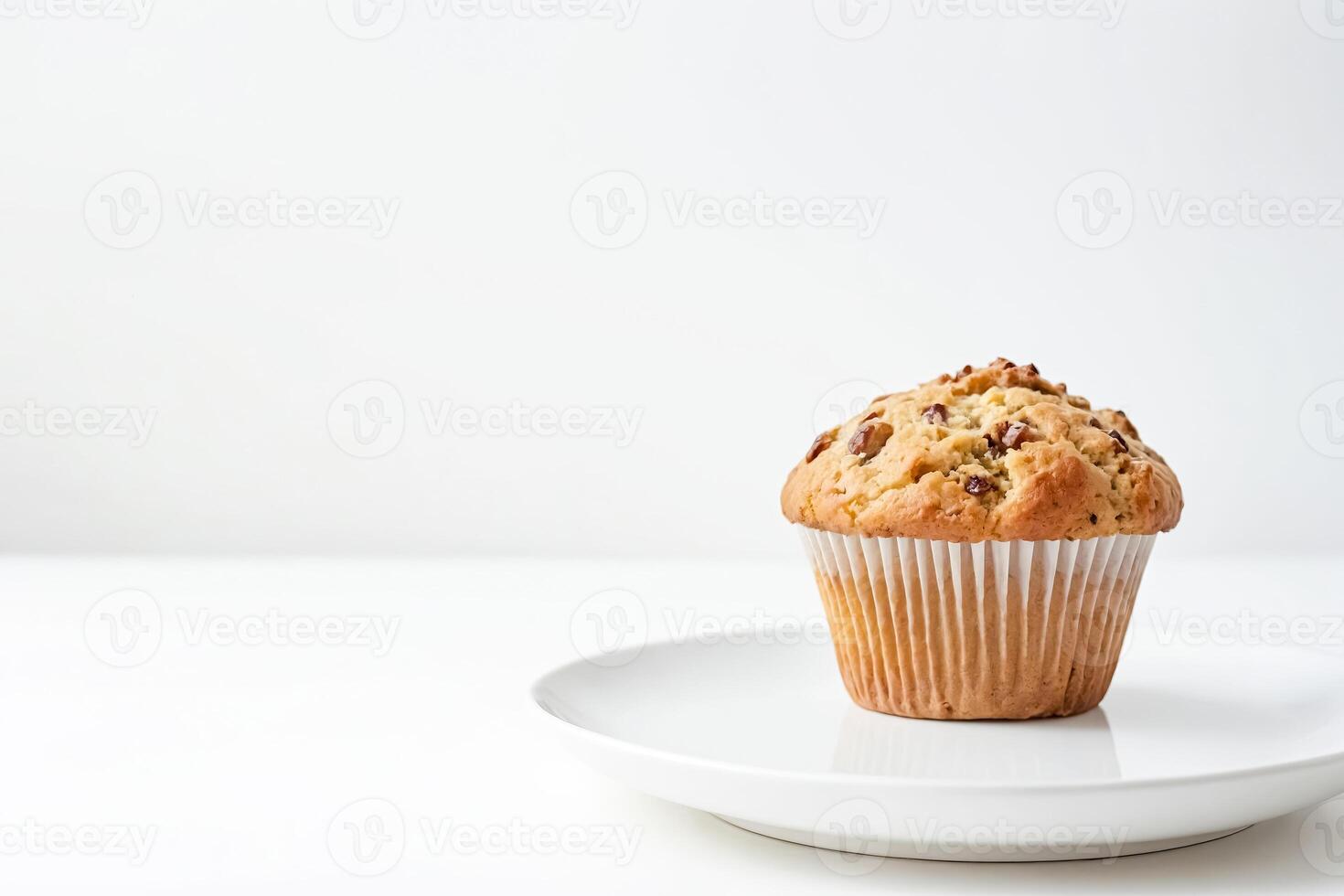 Single muffin on a white plate photo