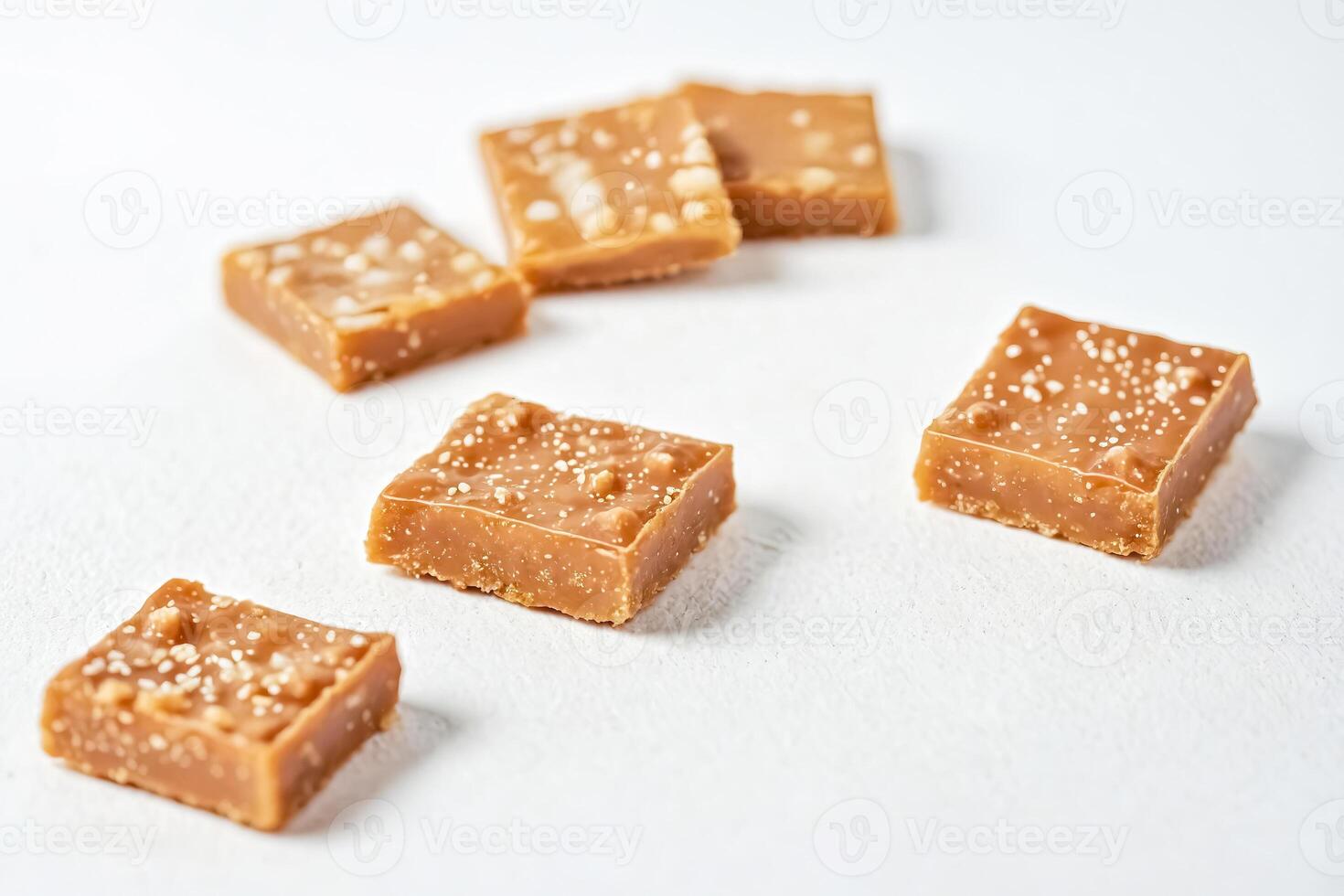 Closeup of Salted Caramel Squares on White Background photo