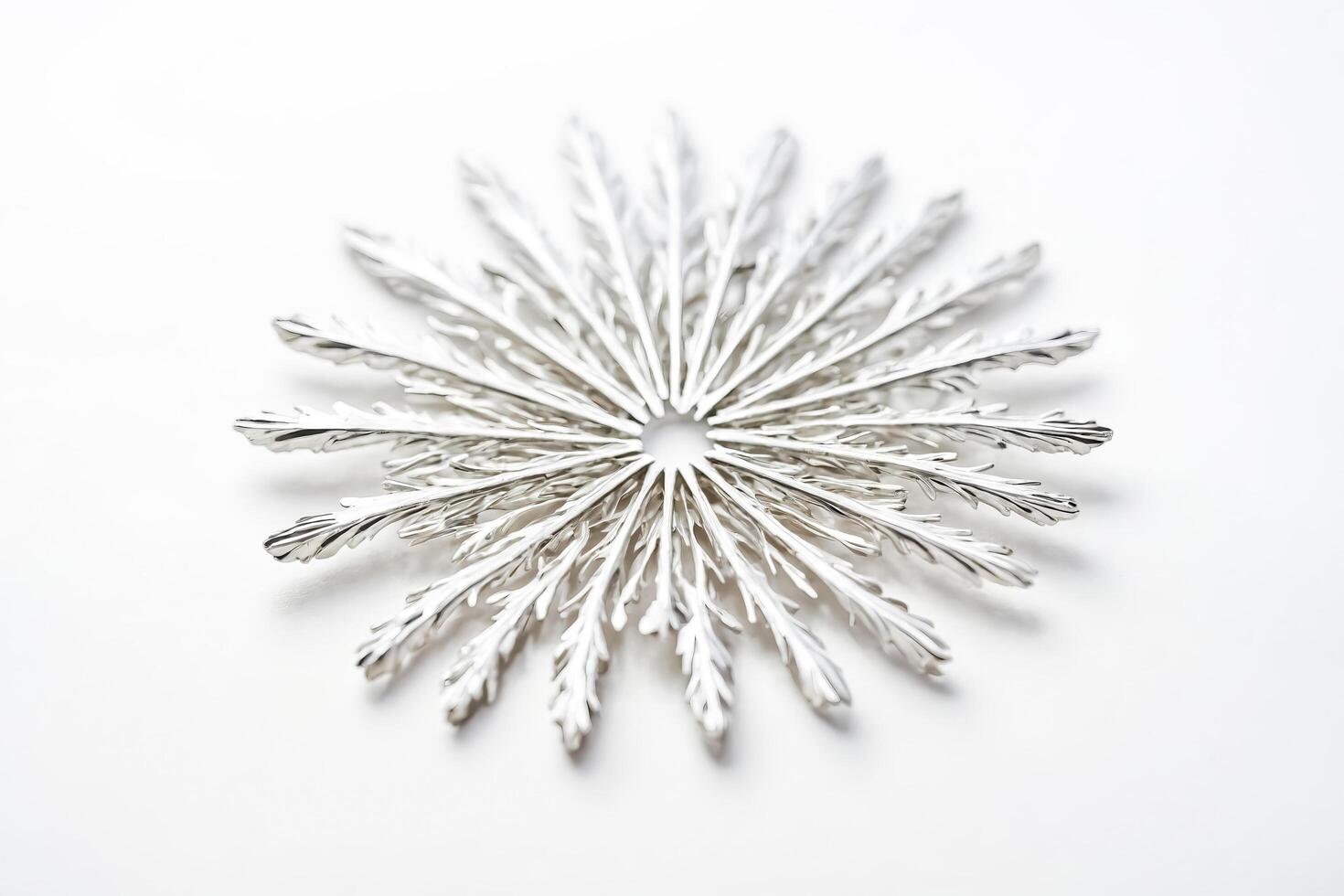 Silver snowflake ornament on a white background photo