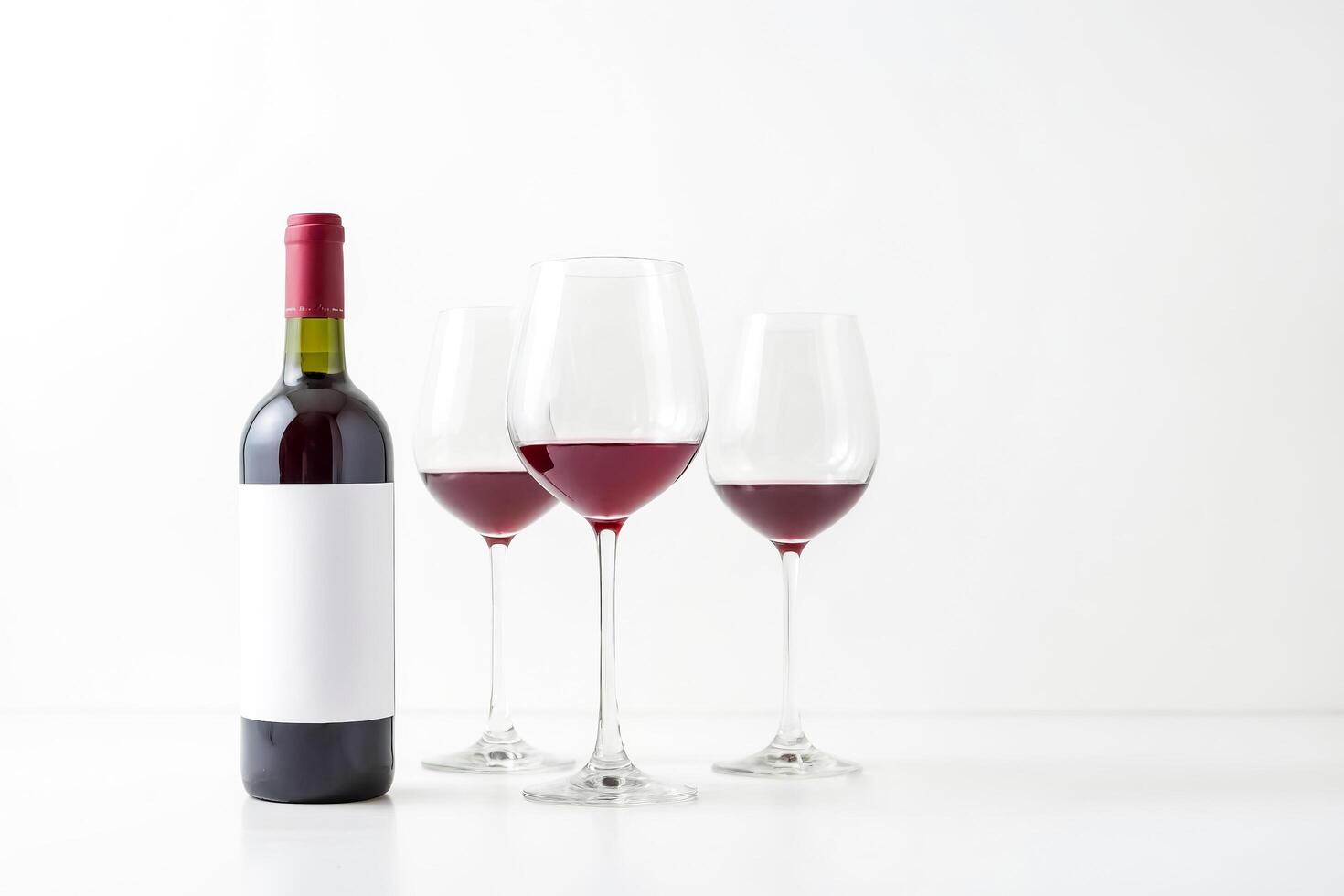 Bottle of Red Wine with Two Glasses on White Background photo