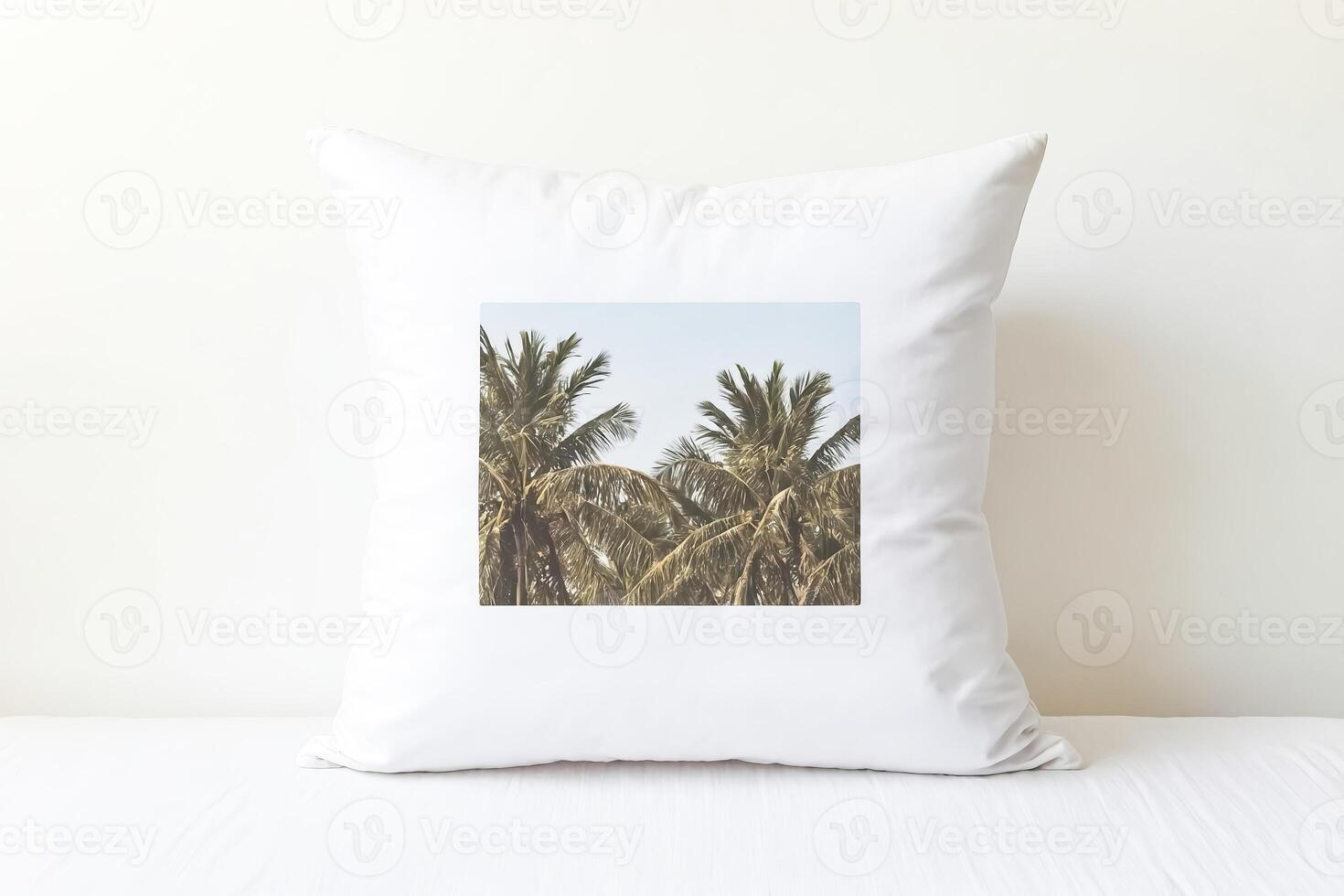 White Pillow with Palm Tree Design on a White Bed photo