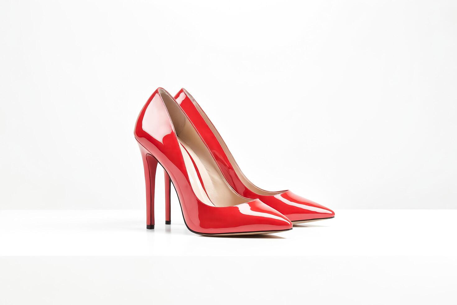Red high-heeled shoes on a white background photo