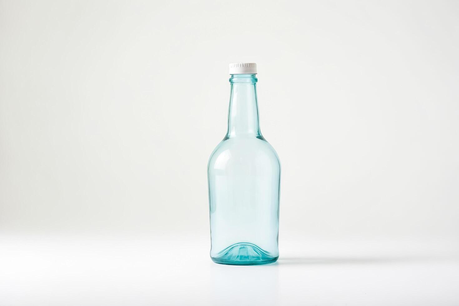 Blue glass bottle with white cap photo