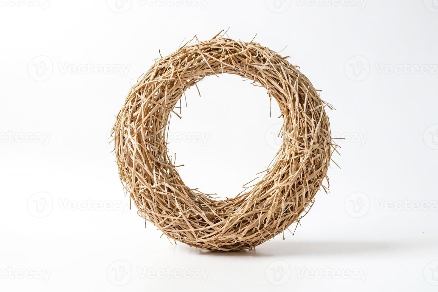 Closeup of a Natural Straw Wreath on a White Background photo