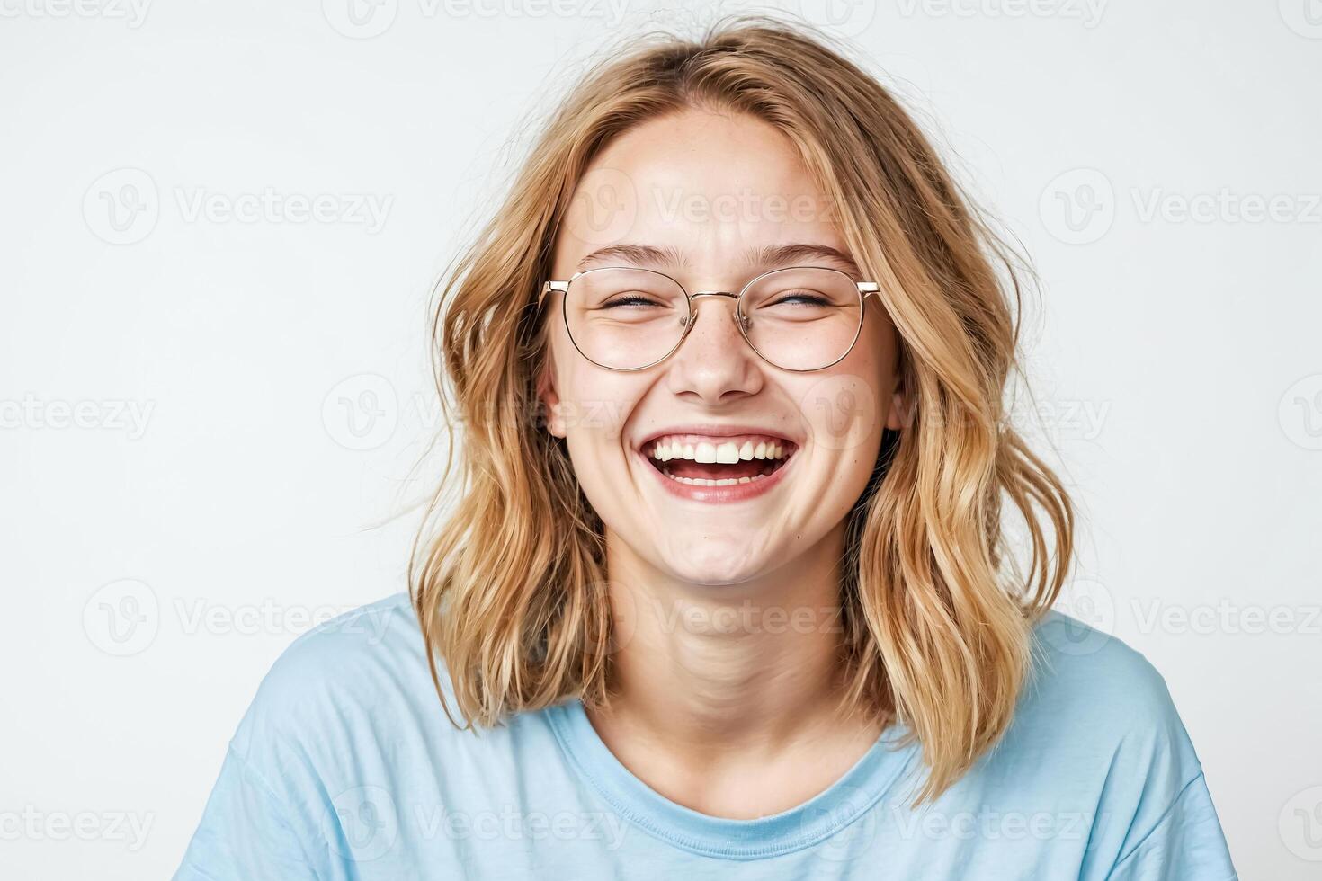Young Woman with Glasses Laughing Joyfully photo