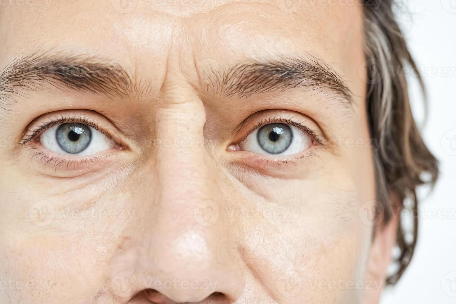 Close Up Of Blue Eyes Of A Man photo