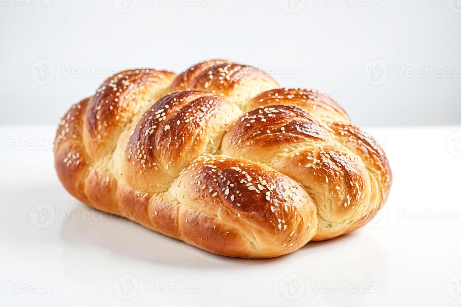 Close-up of a Braided Bread Roll with Sesame Seeds photo
