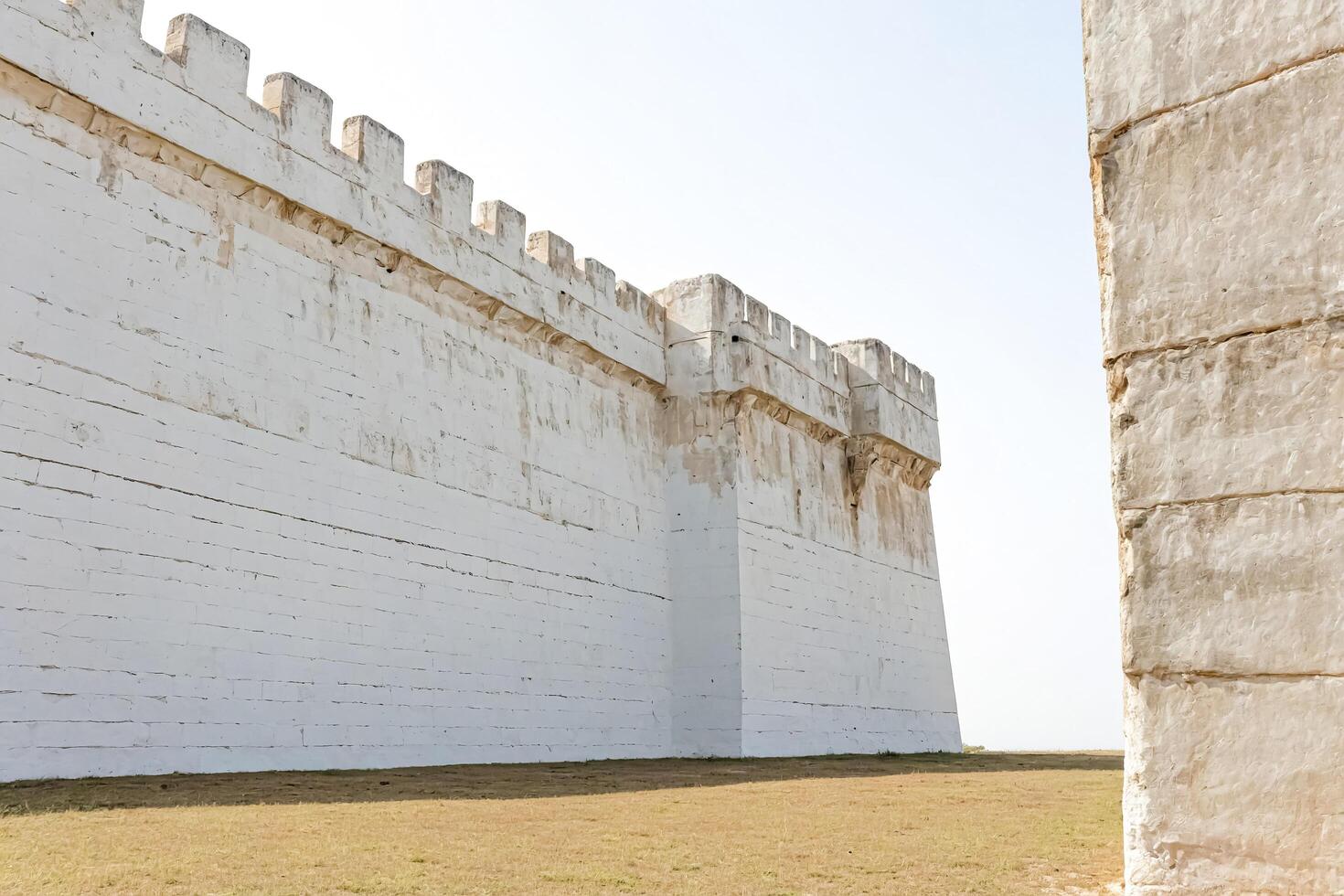 Ancient White Stone Wall of a Medieval Fortress photo