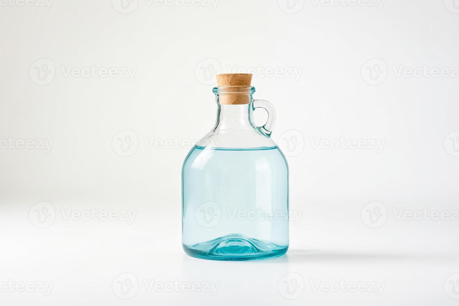 Blue glass bottle with cork stopper on white background photo