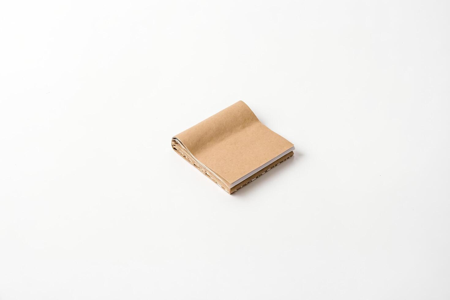 Close-up of a Brown Notebook on White Background photo