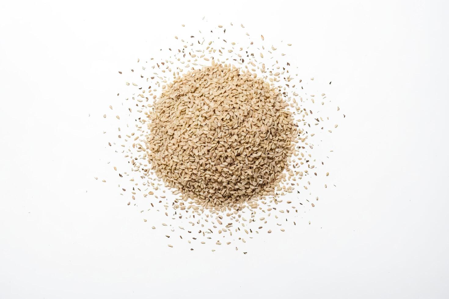 Sesame Seeds Scattered On White Background photo