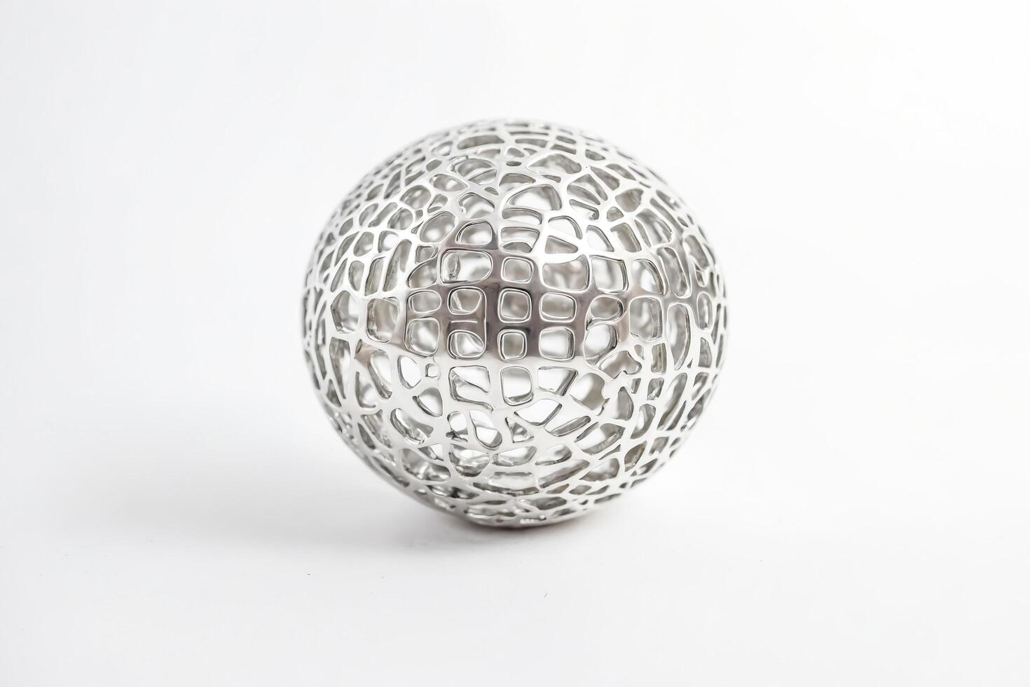 Silver Metal Sphere with Geometric Pattern photo