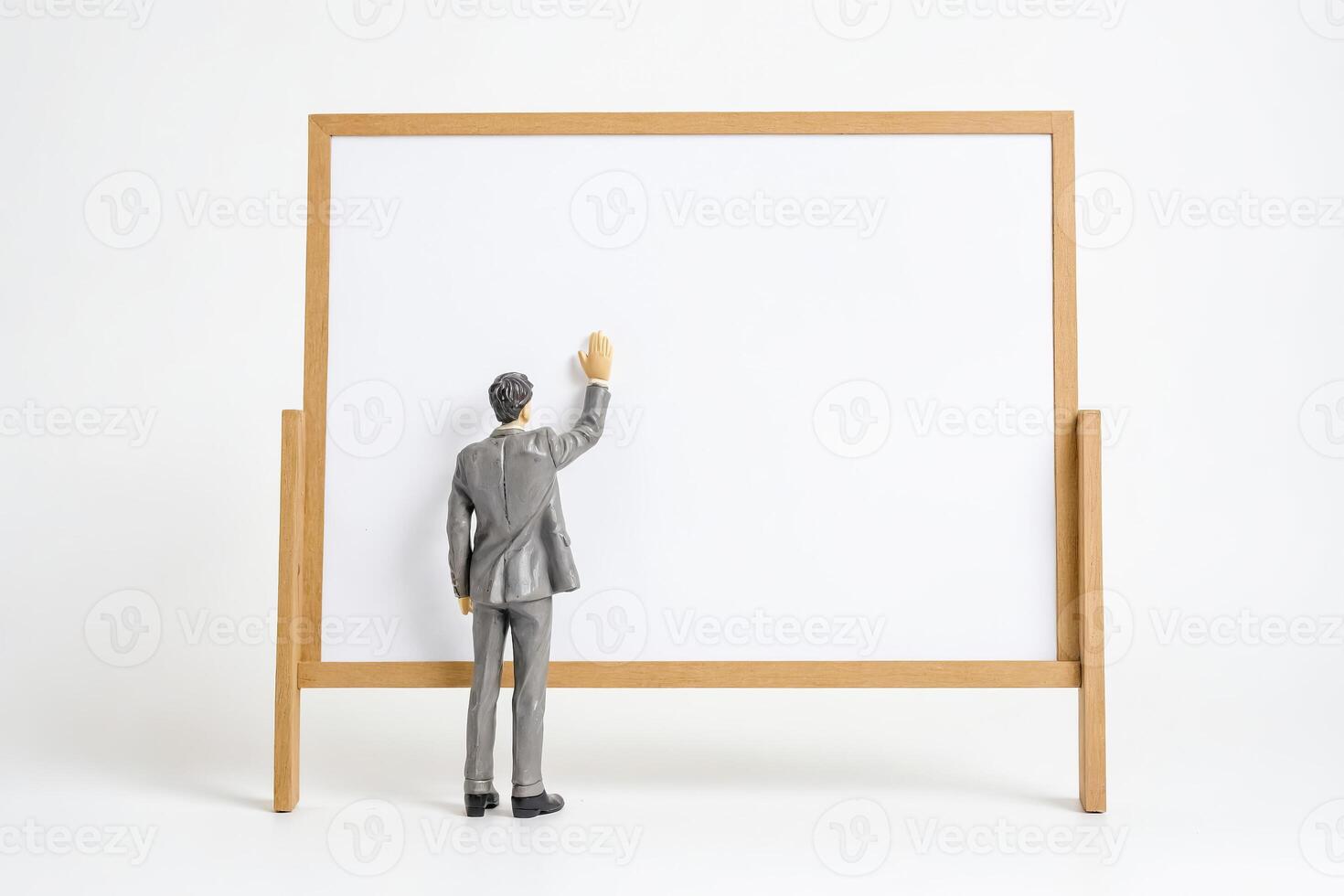 Businessman Presenting on a Blank Whiteboard photo