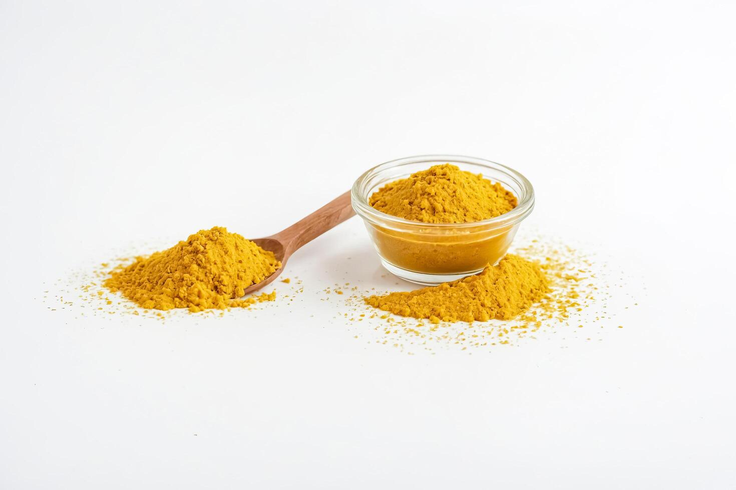 Turmeric Powder in a Bowl and Spoon photo
