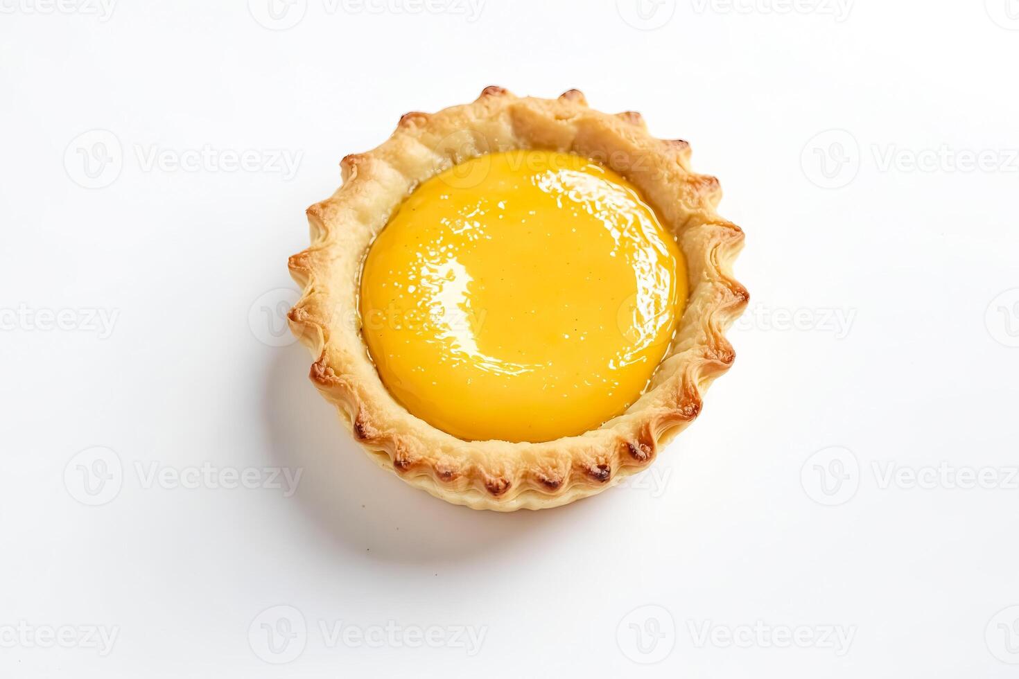 Close up of a single custard tart on a white background photo