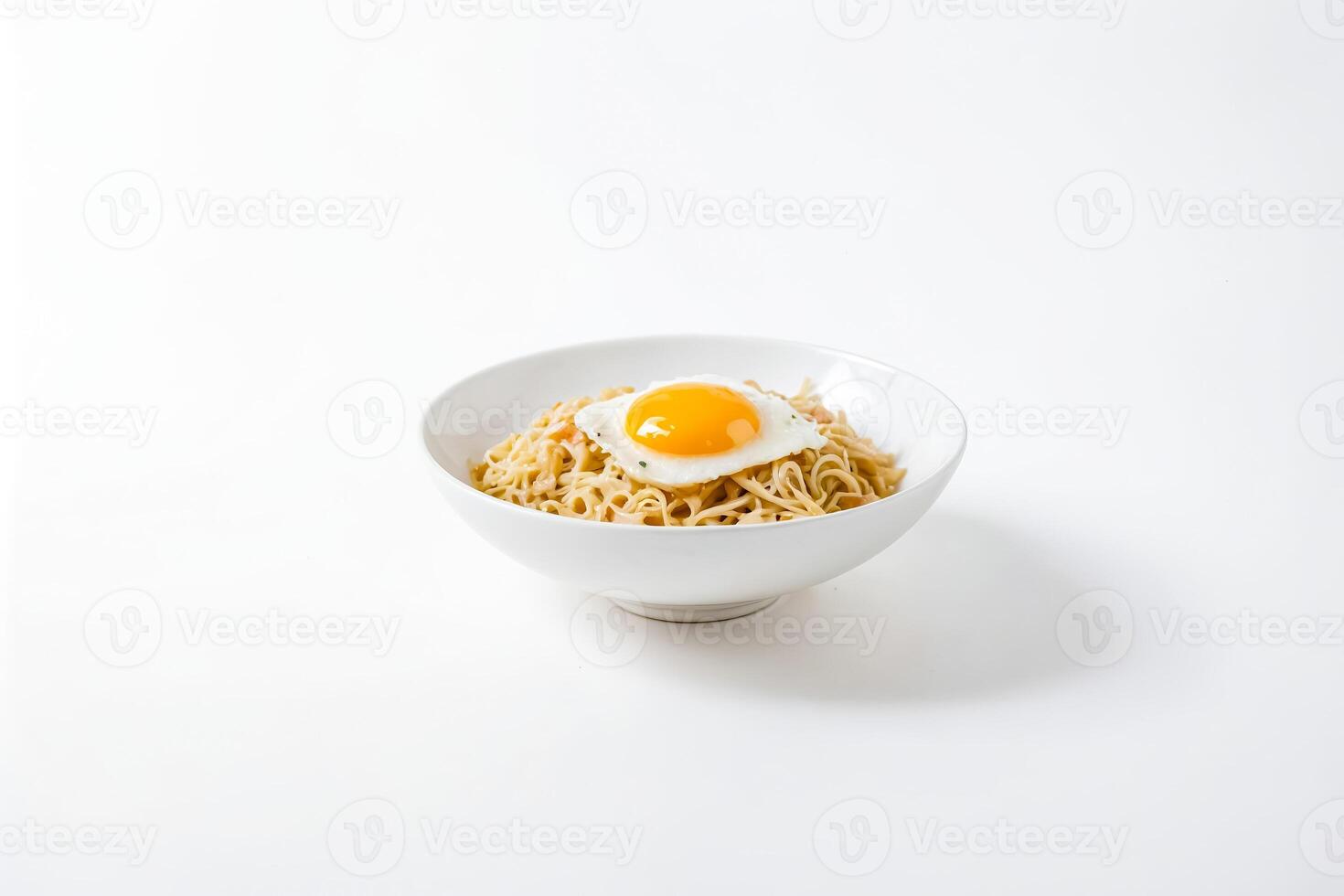 Noodles with a Fried Egg in a White Bowl photo