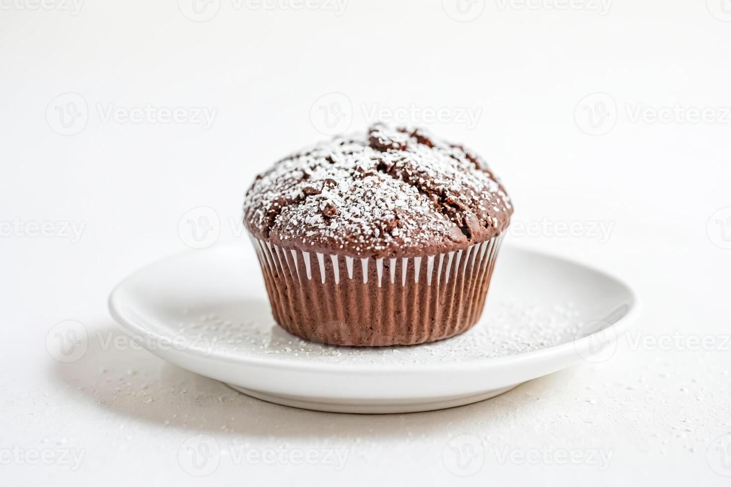 Closeup of a Chocolate Muffin with Powdered Sugar photo
