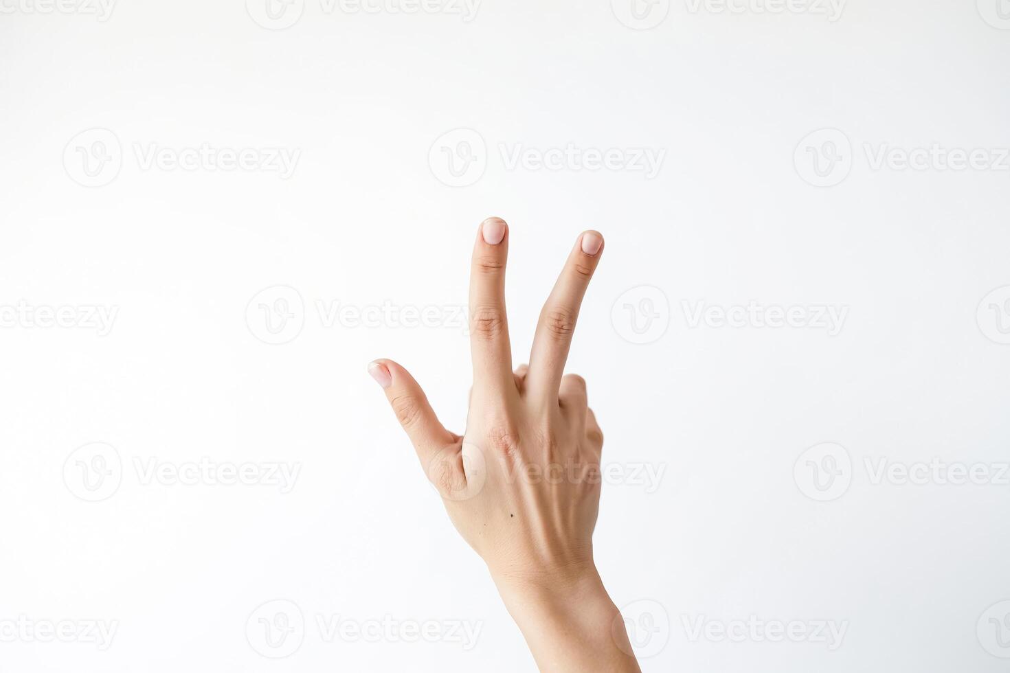 Woman's hand showing three fingers photo