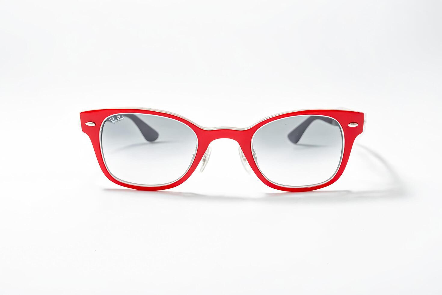 Red Ray-Ban Sunglasses on White Background photo