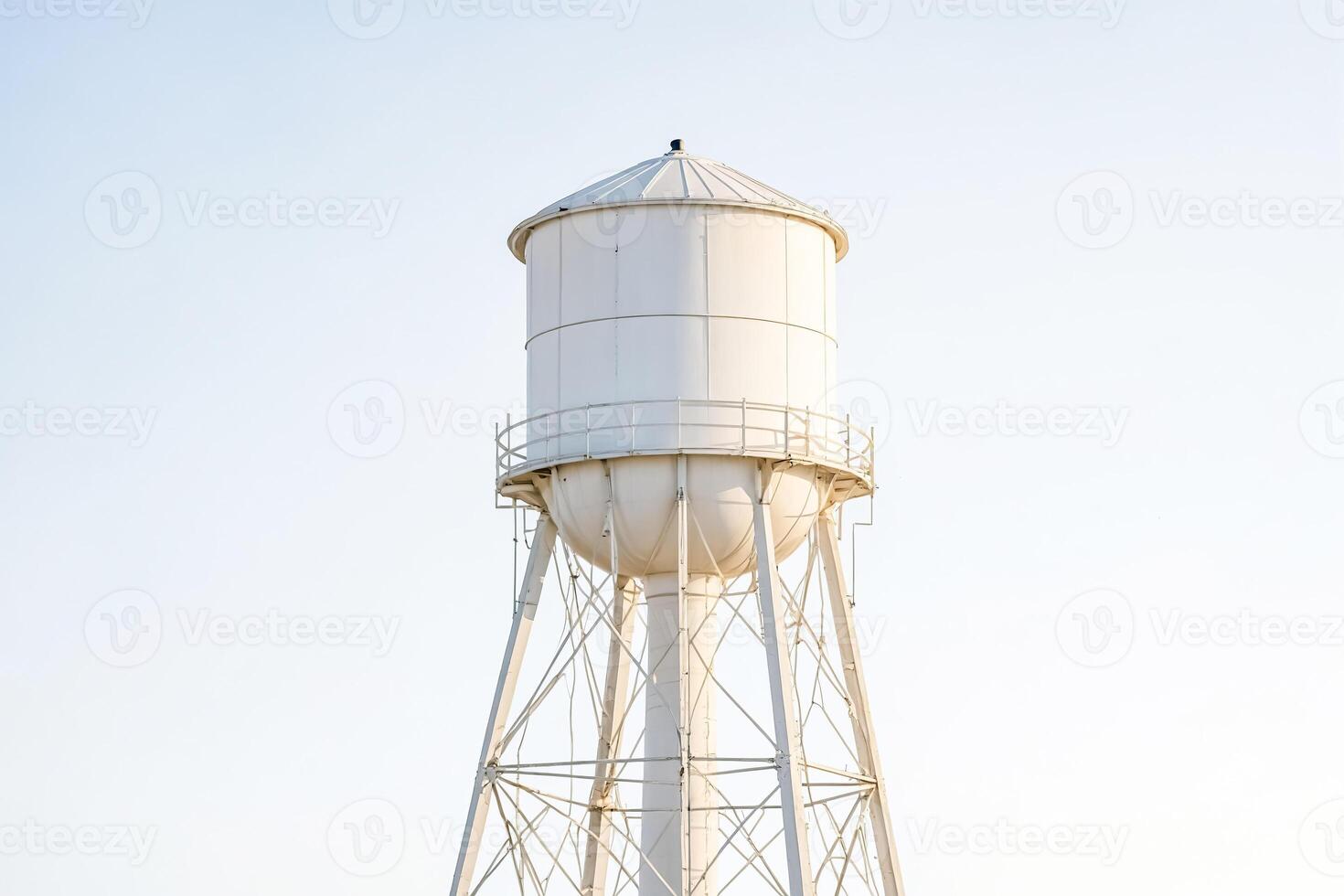 White Water Tower Against Blue Sky photo