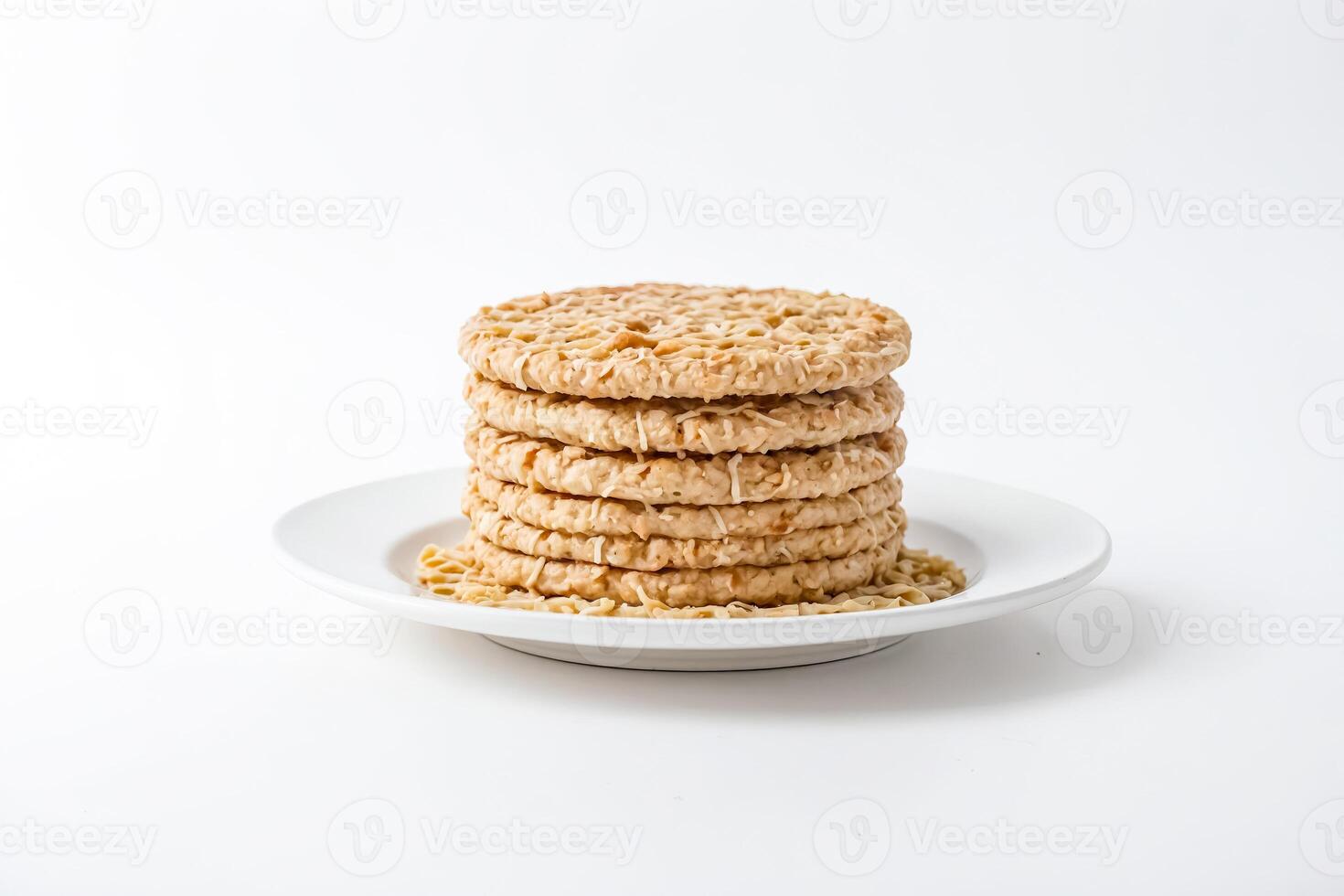 Close-up of a Stack of Round Crackers on a White Plate photo