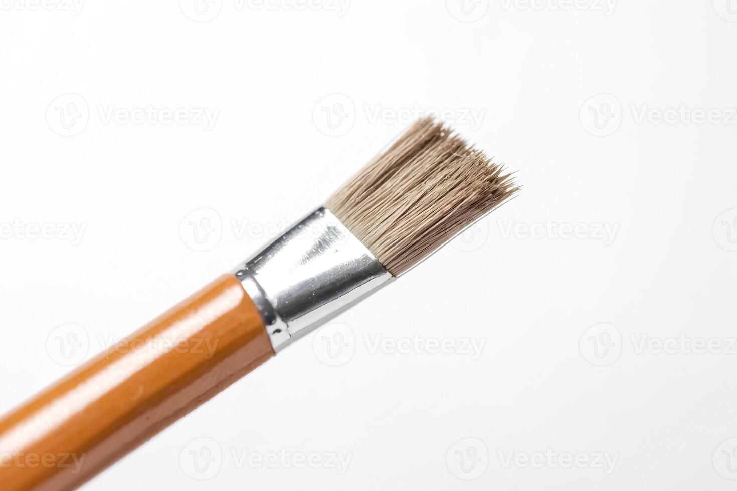 Close up of a paintbrush on a white background photo