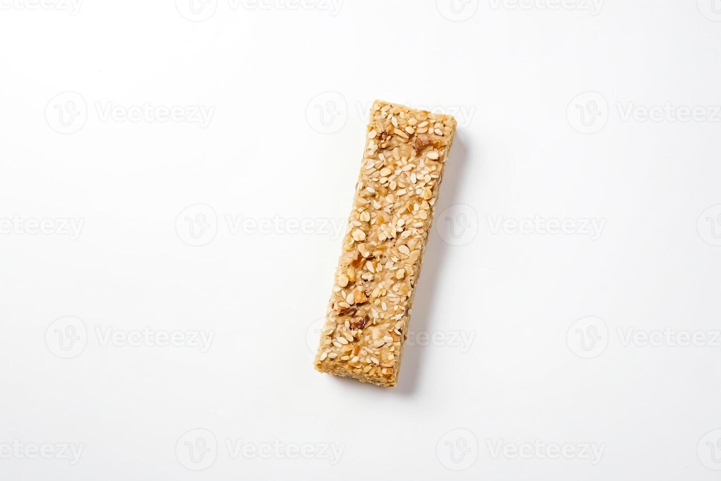 Single Sesame and Nut Granola Bar on White Background photo