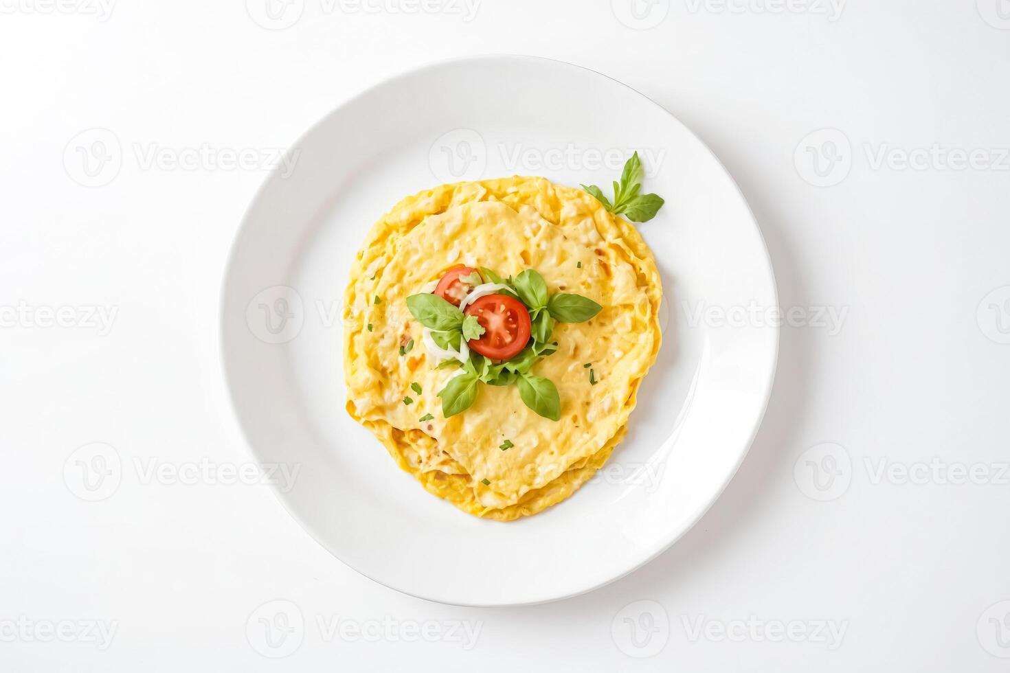 Omelette with tomato and basil on white plate photo