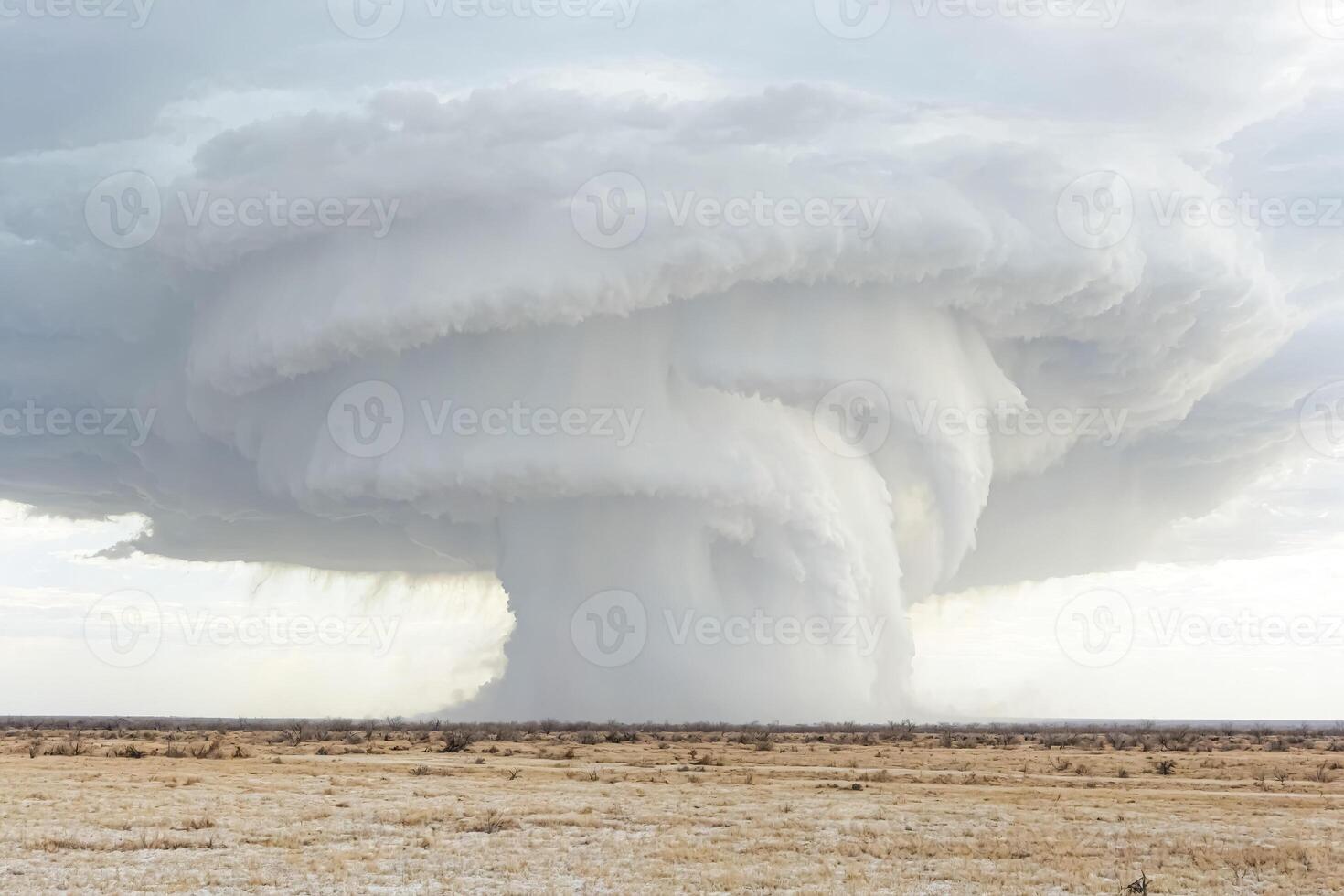 Massive Storm Clouds Forming Over Dry Desert photo