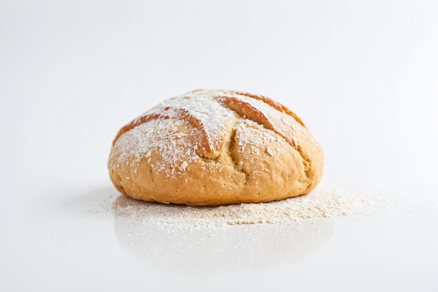 Freshly Baked Bread Roll with Powdered Sugar on White Background photo